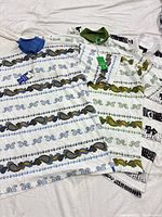 Three Nimbus paisley polo shirts with tags