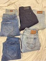 All six pairs folded showing color variety and leather patches