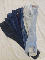 Stack of eight jeans assorted washes