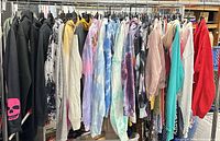 Full rack showing all 18 hoodies side by side