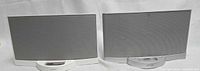 Front view of both Bose SoundDock units showing grille and dock connectors