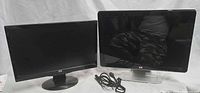Front view of both monitors side-by-side with cables