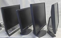 Front view of four monitors powered off