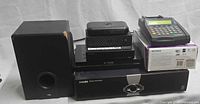 Front view showing all eight electronics items
