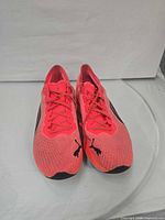 Top view of both shoes showing color logos and condition