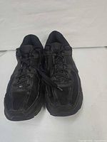 Oblique front view of both shoes showing uppers and laces