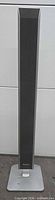 Front view of Panasonic SB-FS940 slim tower speaker showing grille and base