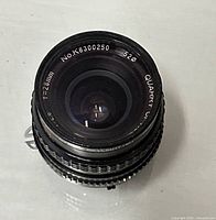 Front element showing brand, focal length and serial number