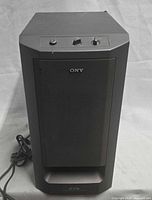 Front view of Sony SA-WMS230 subwoofer showing grille and controls