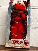 Front view of boxed Elmo figure