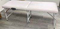 table fully set up, showing padded surface and legs