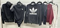 All six Adidas garments hanging for overview