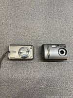 Front view of both Fujifilm cameras side by side
