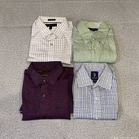 All four folded dress shirts displayed together