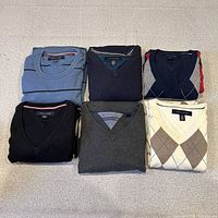 All six folded sweaters arranged for overview