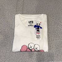 Folded T-shirt with hangtag visible
