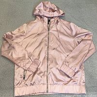 Front view of pink hooded satin bomber jacket