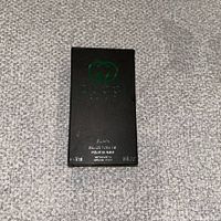 Front of black Gucci Guilty Black sample card packaging