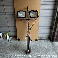 Front view of dual-head work light on tripod