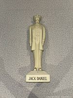 Front view showing full statue and name on base