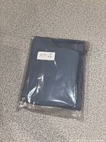 Leggings folded in original plastic bag with size label visible