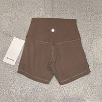 Front view of brown Align HR Short 4" with hang tag