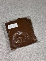 Tank top sealed in plastic bag