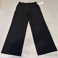 Full view of black wide-leg pant laid flat