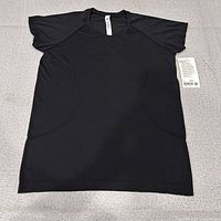 Front view of black Lululemon Swiftly Tech Short Sleeve 2.0 top