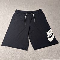 Full view of black Nike fleece shorts