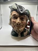 Front view of Royal Doulton Robin Hood character jug
