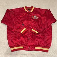 Full view of red quilted satin bomber jacket