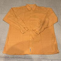 Front view of orange Ted Baker dress shirt laid flat