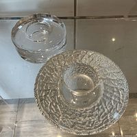 Top view showing both candle holders, Discus textured and smooth round