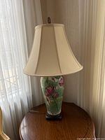 Front view of lamp with shade on table