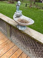 Full view of fairy bird bath on deck railing