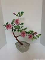 Full view of bonsai sculpture in planter