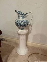 Pitcher on pedestal showing overall appearance
