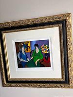 Framed serigraph full view showing artwork, matting and ornate frame