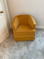 Front view of mustard yellow tub armchair