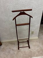 Full front view of wood valet stand