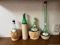 All four demijohn bottles lined up