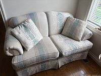 Front view of loveseat with pillows
