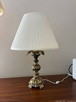 Full view of lamp with shade on tabletop