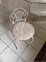 full view of stool showing frame design and seat upholstery