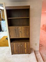 Full view of closed hutch showing shelves, drop-front panel, lower cabinet