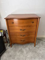 Front view of Vic-Art four-drawer dresser showing overall design and condition