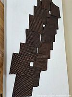 Full view of all napkins laid out showing quantity and pattern