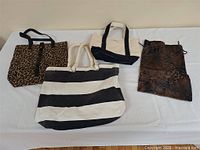 Overall view of all four handbags on table