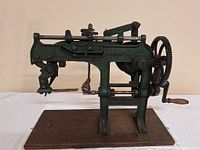 full view of Bonanza apple peeler on wood base